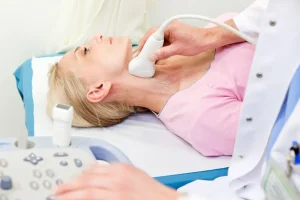 Patient undergoing medical consultation for carotid artery assessment, essential in stroke prevention. Details about carotid disease symptoms and surgical interventions, including carotid surgery and carotid stenting, in our article.