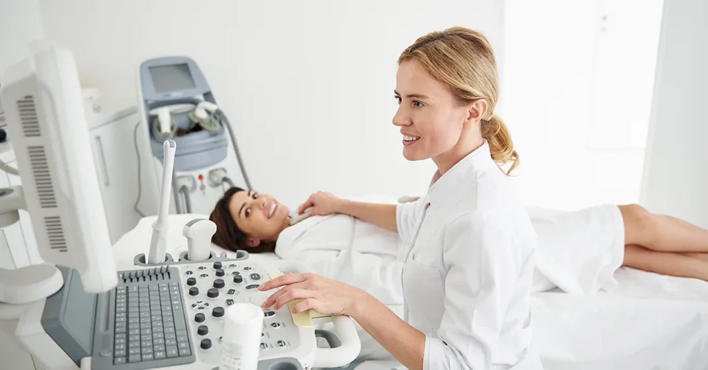 Representative image for the medical ultrasound service with a patient on the examination table during an ultrasound scan